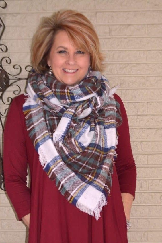 Thanksgiving outfit for women over 50: burgundy dress with big plaid scarf
