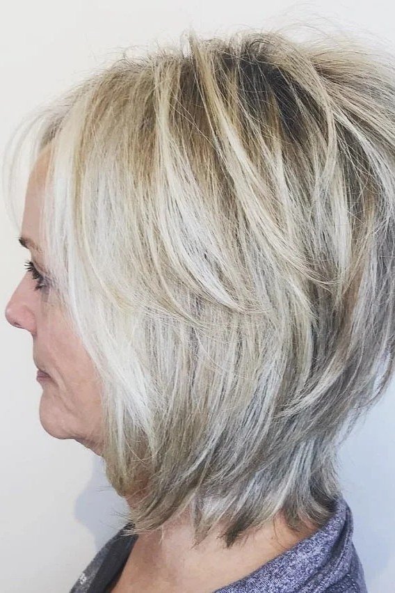 Silver short shaggy bob side profile for older women
