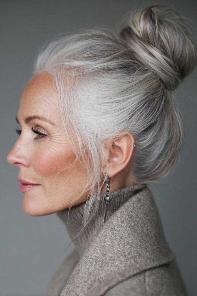 high sleek silver topknot for women over 60