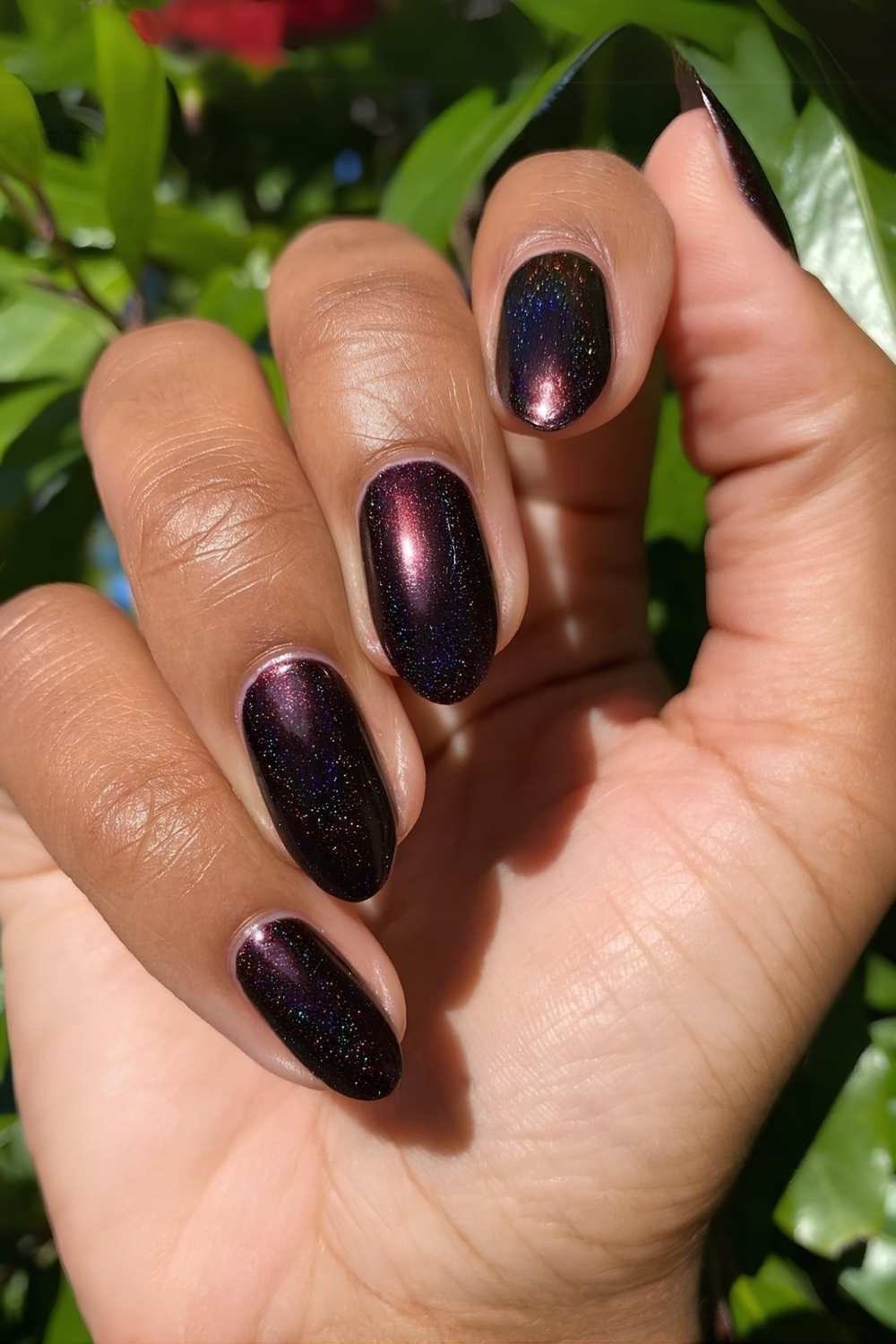 Dark plum metallic shimmer oval nails