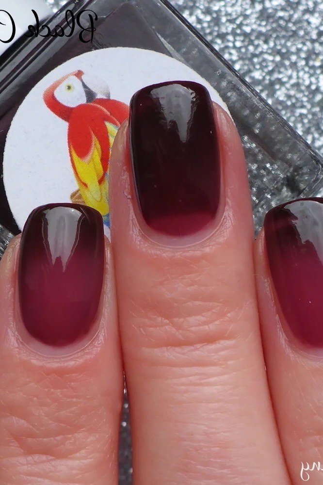 Plum jelly squoval nails close up
