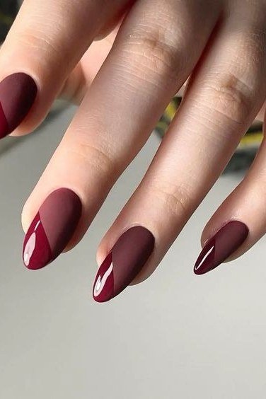 Matte plum almond nails with glossy cherry red French tips