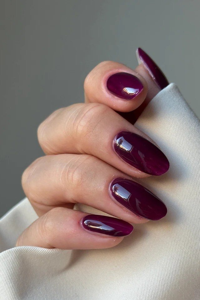 Glossy cherry cola almond nails