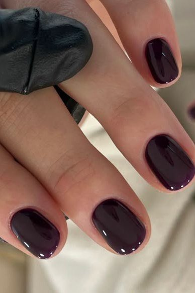 Dark plum almond nails