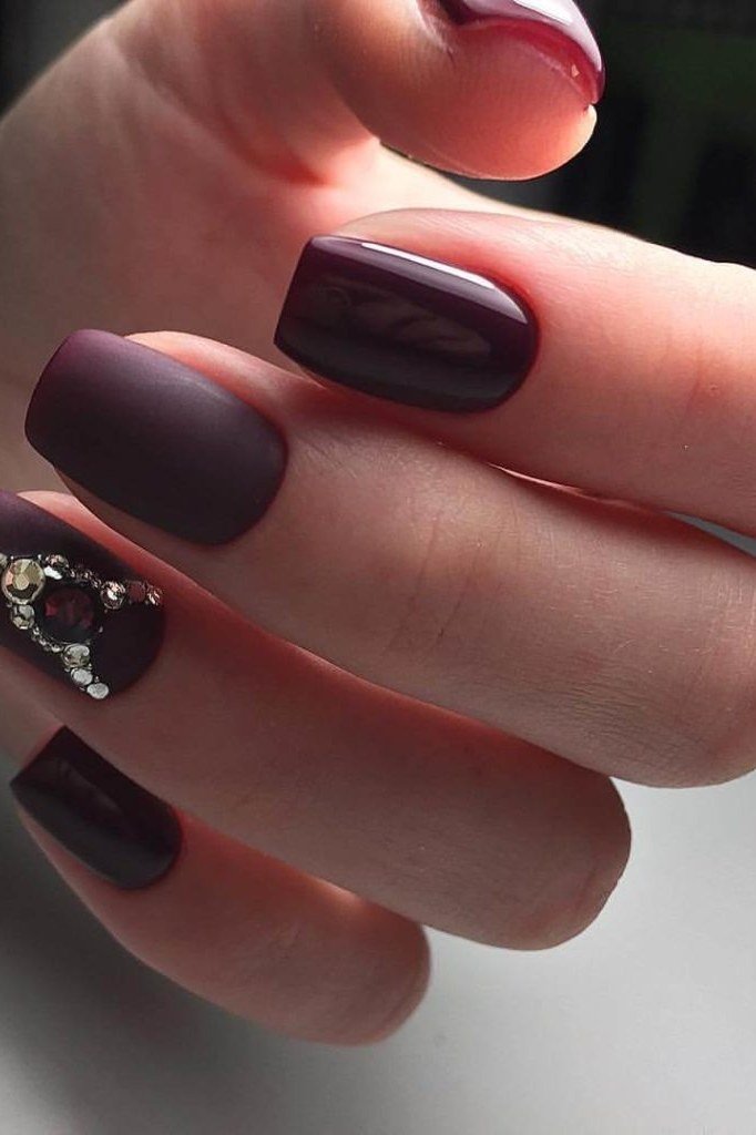 Matte plum squoval nails with crystal nail art