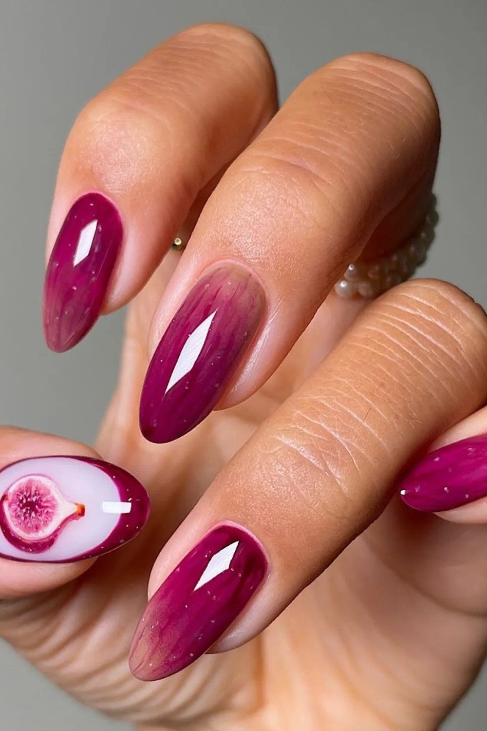 Soft magenta aura almond nails