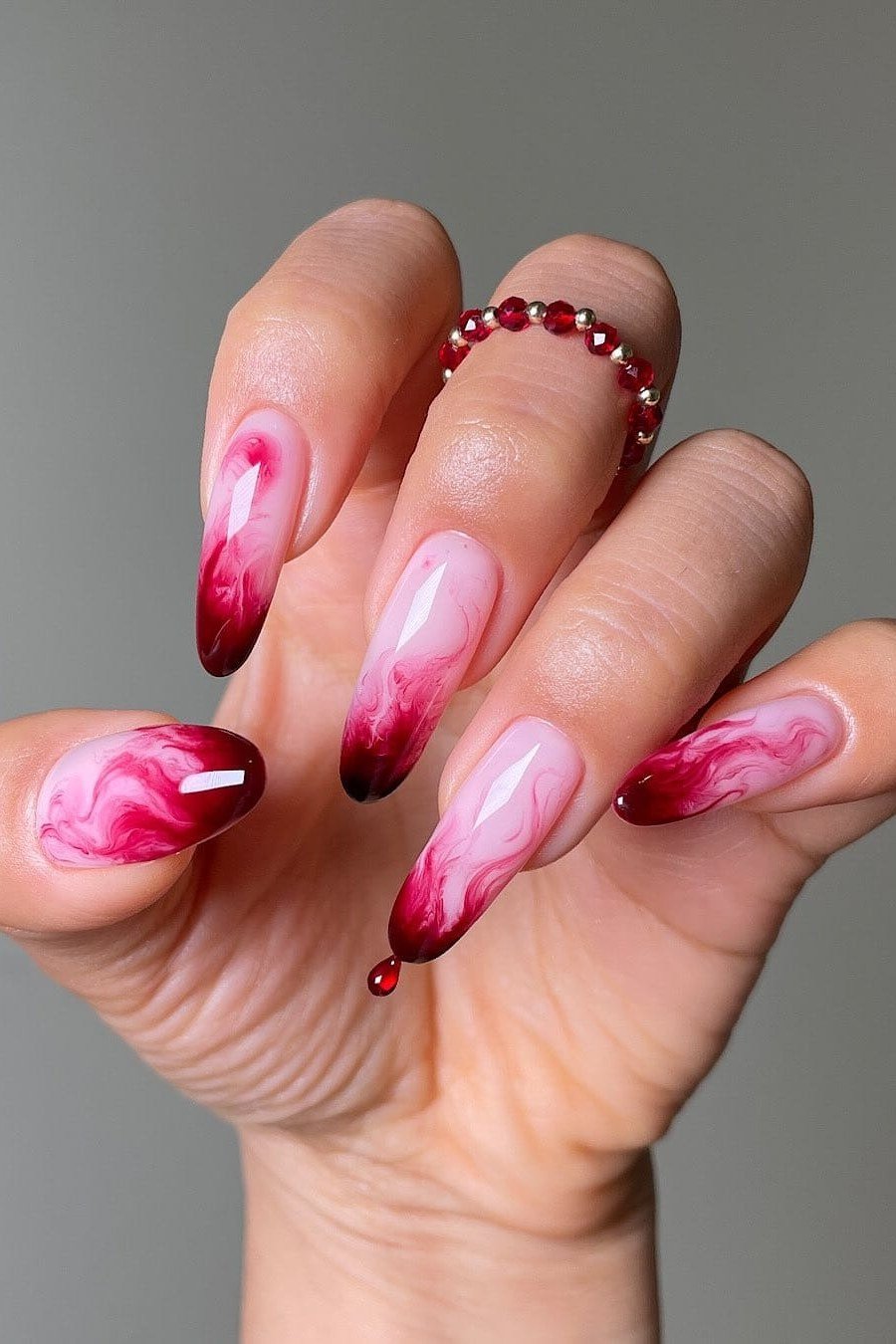 Pink and magenta aura stiletto nails