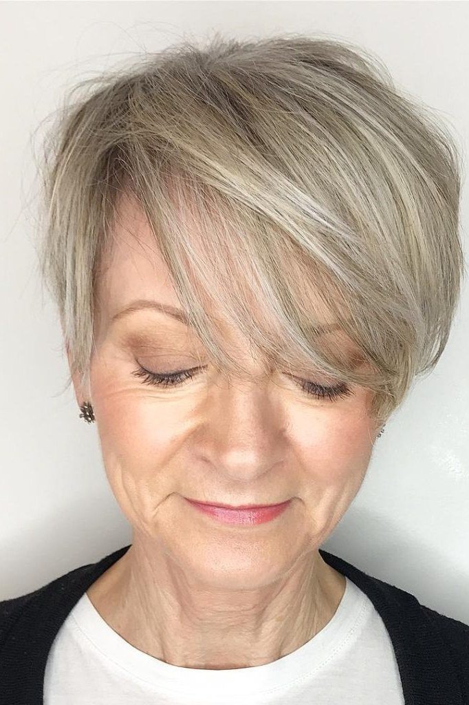 Silver layered bob, three-quarter view, feathered texture for women over 40