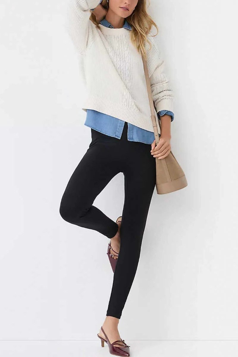 Cream sweater over chambray shirt, black leggings, burgundy flats, leggings outfit idea for women over 50