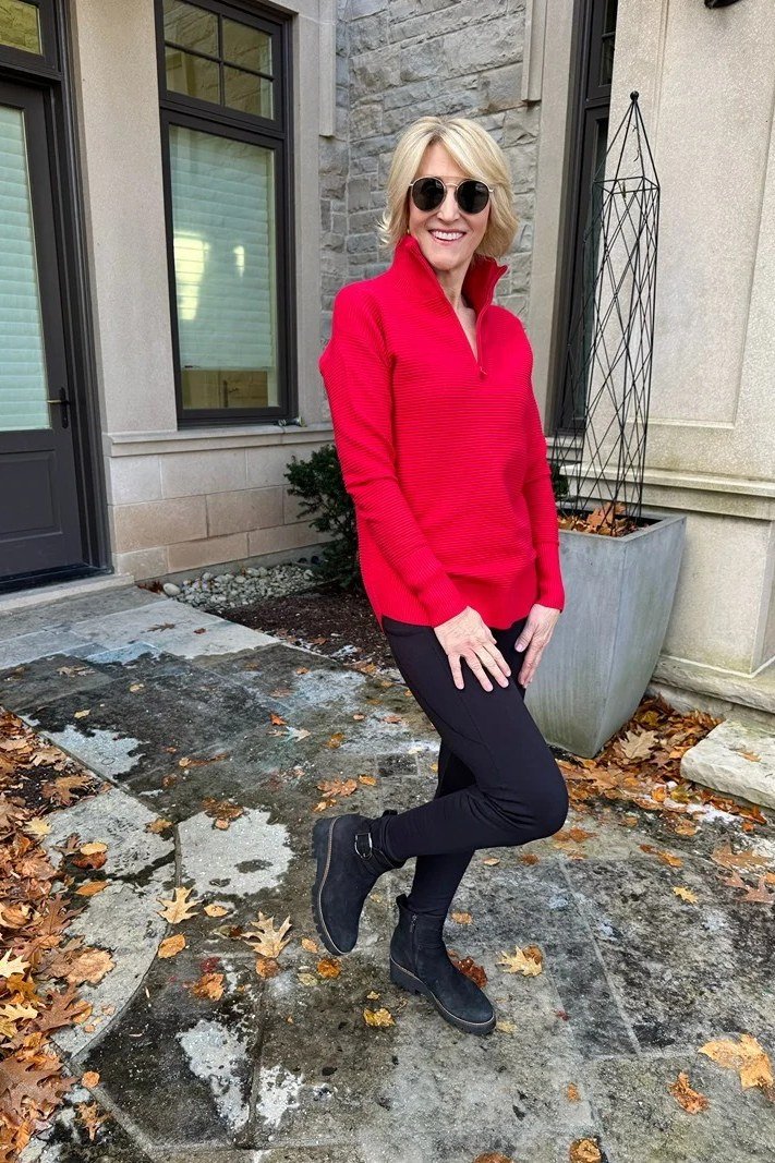 Red blazer, black leggings, black booties, stone patio, leggings outfit idea for women over 50