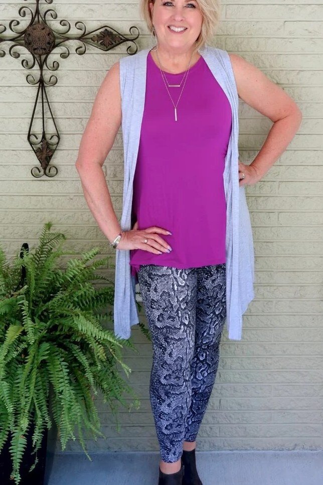 Lavender cardigan over magenta tank, gray patterned leggings, black booties, leggings outfit idea for women over 50
