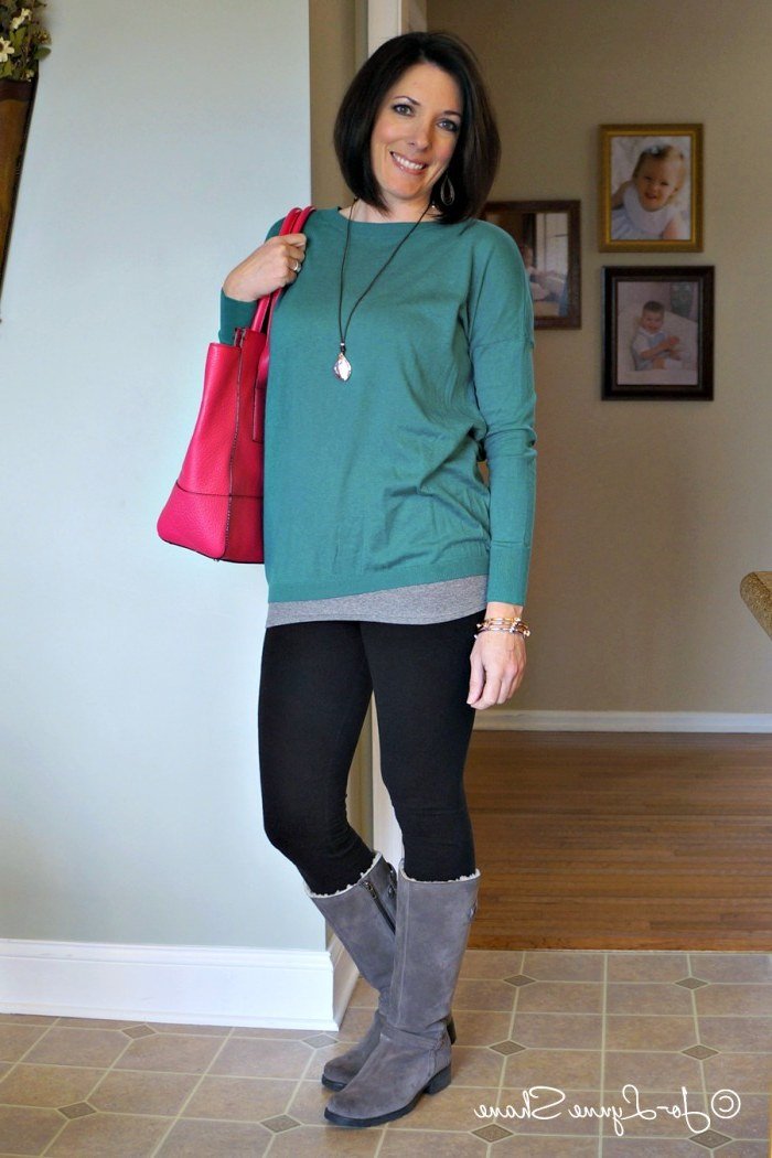 Teal tunic, black leggings, gray boots, pink handbag, leggings outfit idea for women over 50