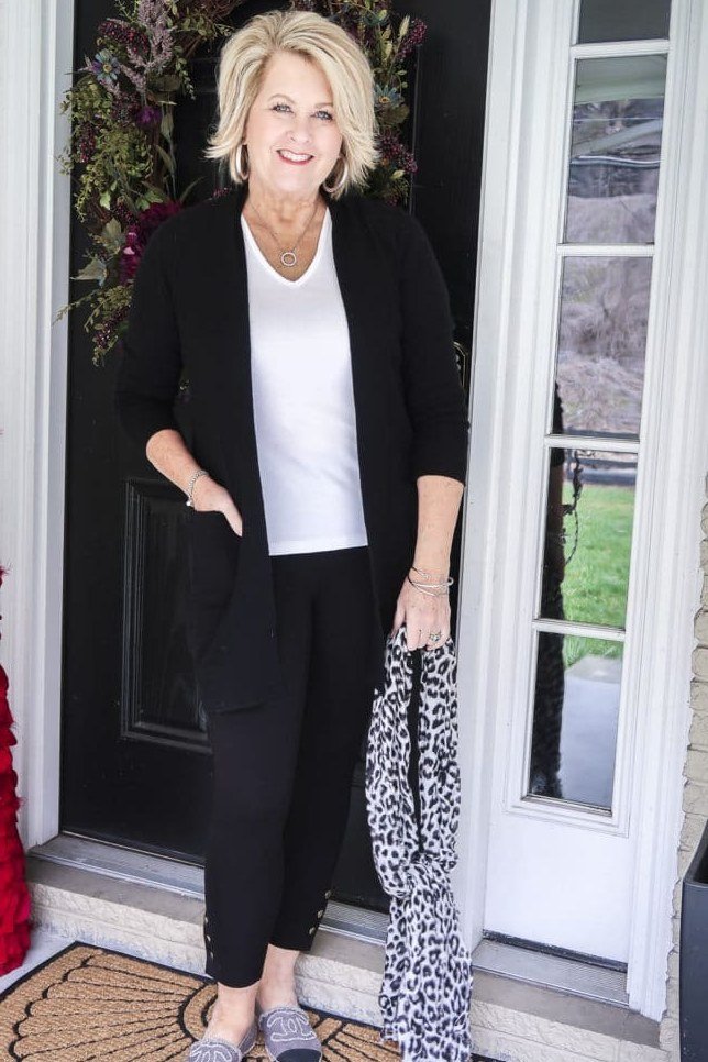 Black blazer over white top, black leggings, leopard scarf, doorstep, leggings outfit idea for women over 50
