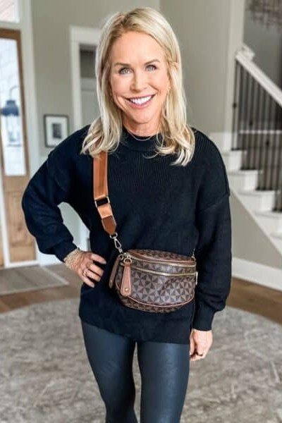 Black sweatshirt, black leggings, brown crossbody bag, athleisure, leggings outfit idea for women over 50
