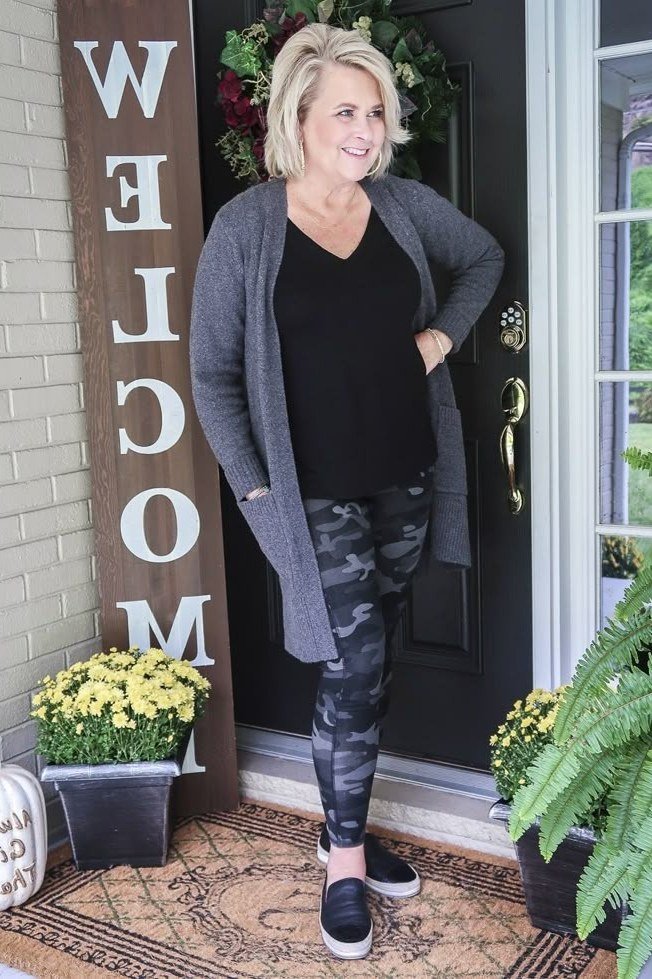 Gray cardigan over black top, camo leggings, black sneakers, welcome porch, leggings outfit idea for women over 50