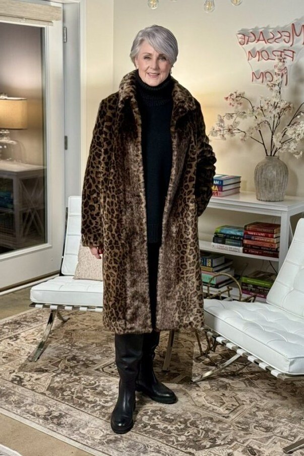 Leopard-print coat over black turtleneck, black leggings, black boots, leggings outfit idea for women over 50