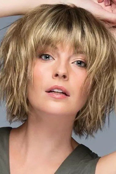 blonde shaggy bob with curtain bangs, front view, low-maintenance hairstyle for women over 40