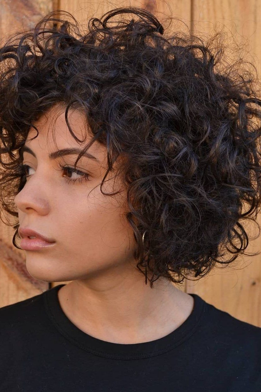 dark curly short bob with natural texture, profile, low-maintenance hairstyle for women over 40