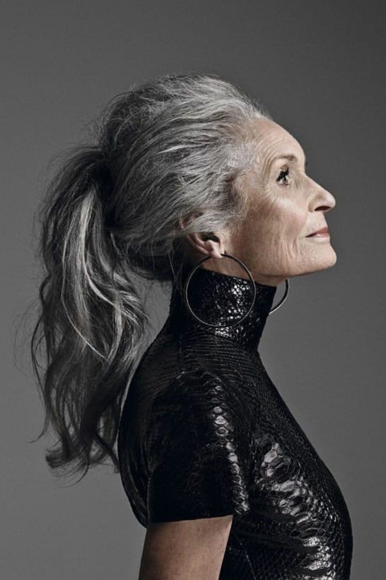 Salt-and-Pepper Ponytail - long hairstyle for women over 60 with thin hair (salt-and-pepper ponytail, side profile, pony tail)
