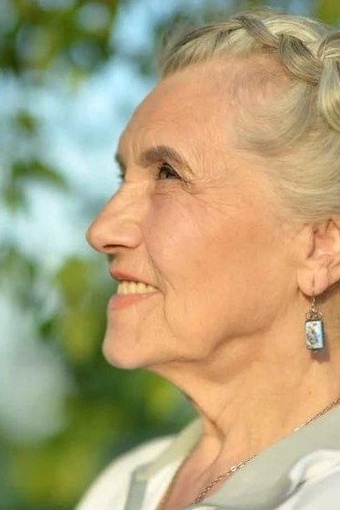 Braided Crown - long hairstyle for women over 60 with thin hair (braided crown long hair, side view, braid wrapped over top)