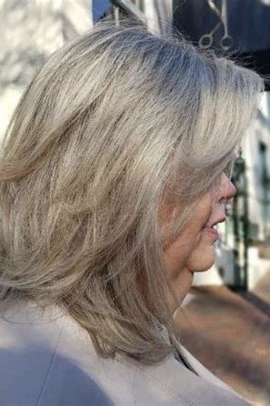Grey Feathered Layers - long hairstyle for women over 60 with thin hair (grey feathered long layers, three-quarter view)