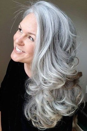 Silver Waves at the Shoulder - long hairstyle for women over 60 with thin hair (silver wavy shoulder-long hair, three-quarter view)