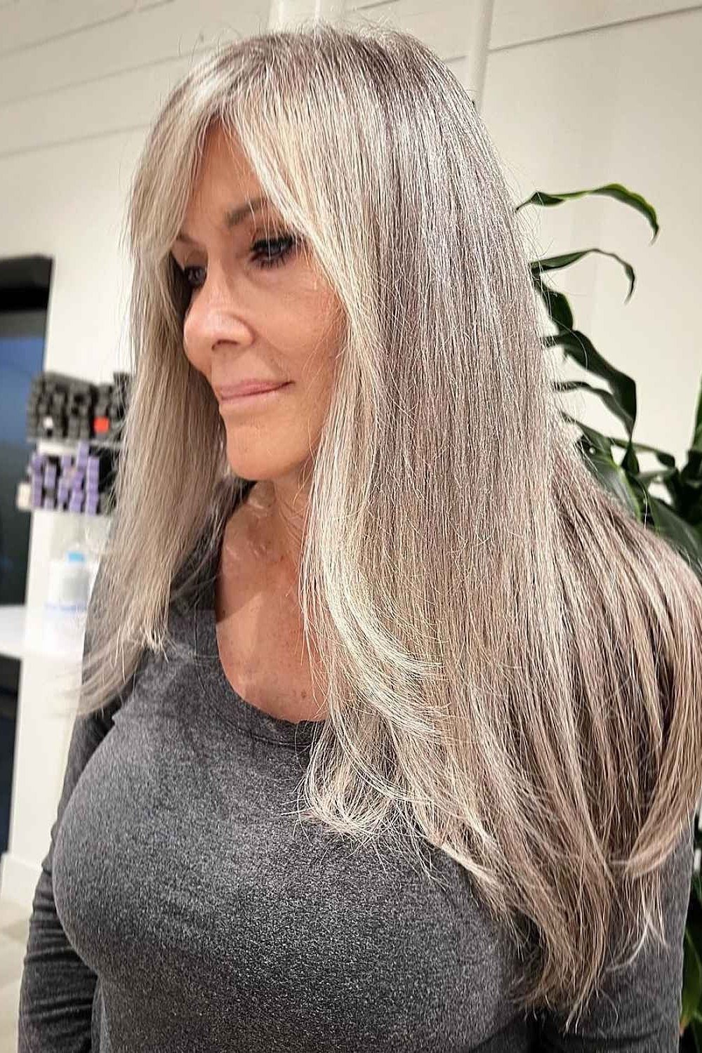 Ash-Blonde Sleek Length - long hairstyle for women over 60 with thin hair (long ash-blonde straight hair, front view, salon)