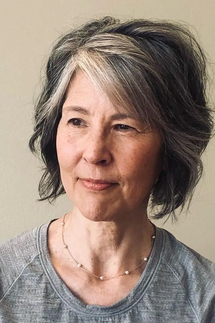 Gray Layered Bob With Face Frame hairstyle for women over 60 - gray layered chin bob, front view