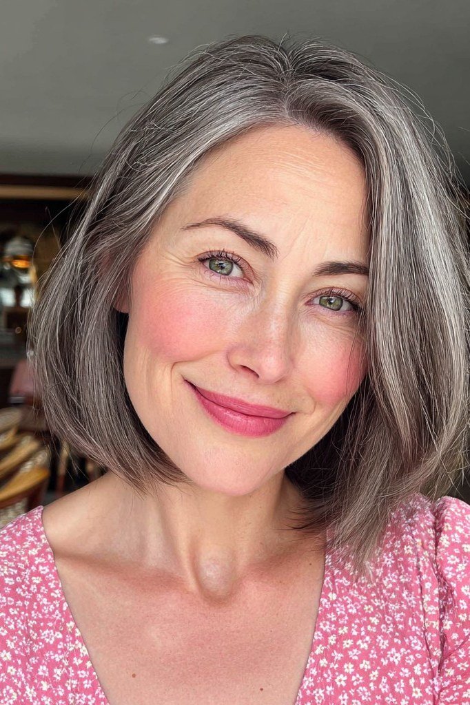 Smiling Silver Lob hairstyle for women over 60 - silver lob, smiling front view