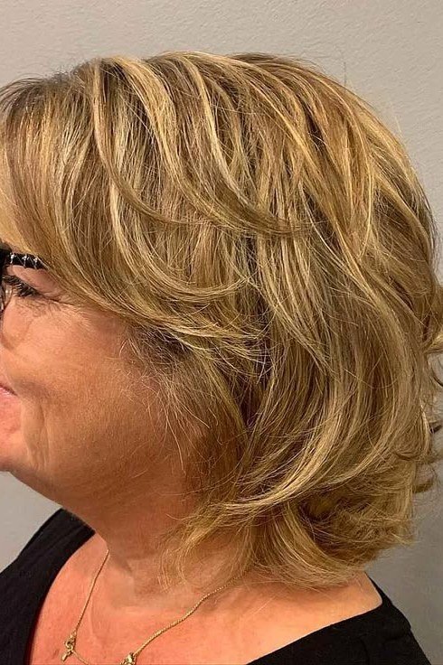 Golden Blonde Wavy Medium Cut - medium-length haircut for women over 60 with fine hair