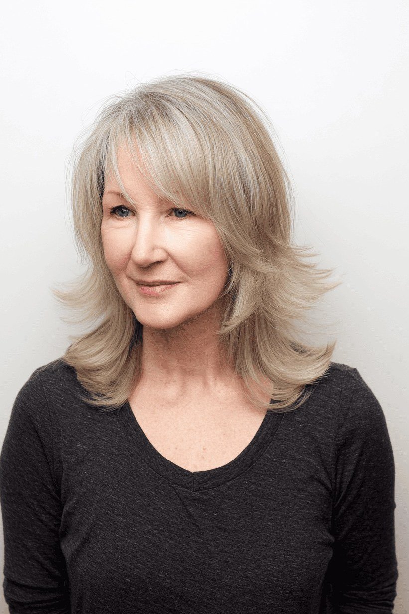 Blonde Layered Medium Cut - medium-length haircut for women over 60 with fine hair