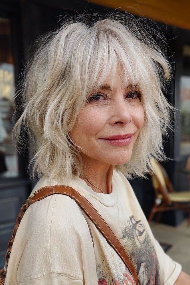 White Shaggy Cut with Bangs - medium-length haircut for women over 60 with fine hair
