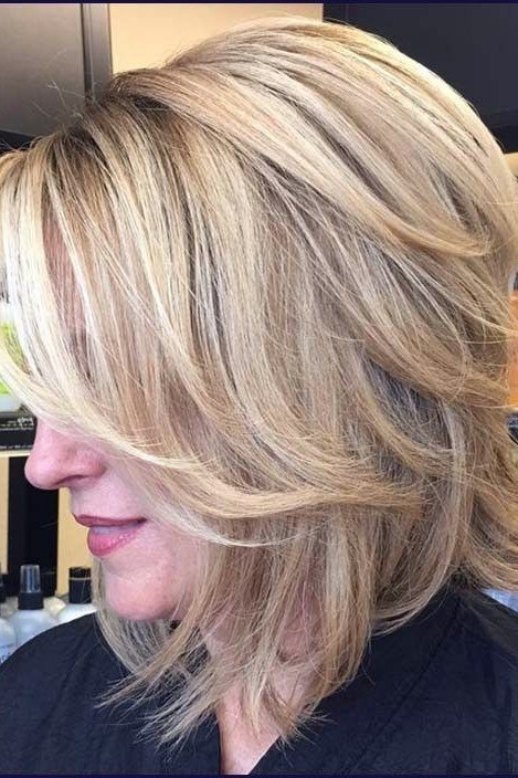 Blonde Layered Side Cut - medium-length haircut for women over 60 with fine hair