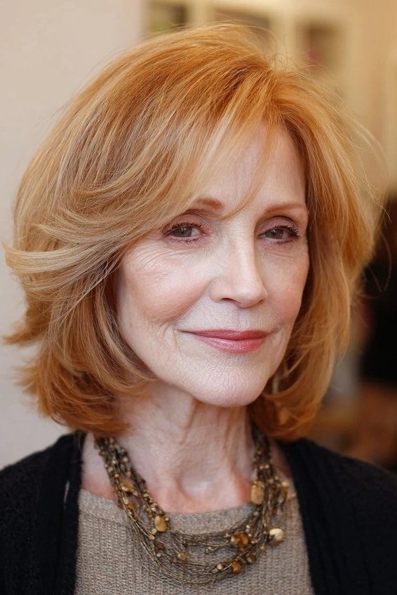 Copper blonde layered bob haircut for women over 60