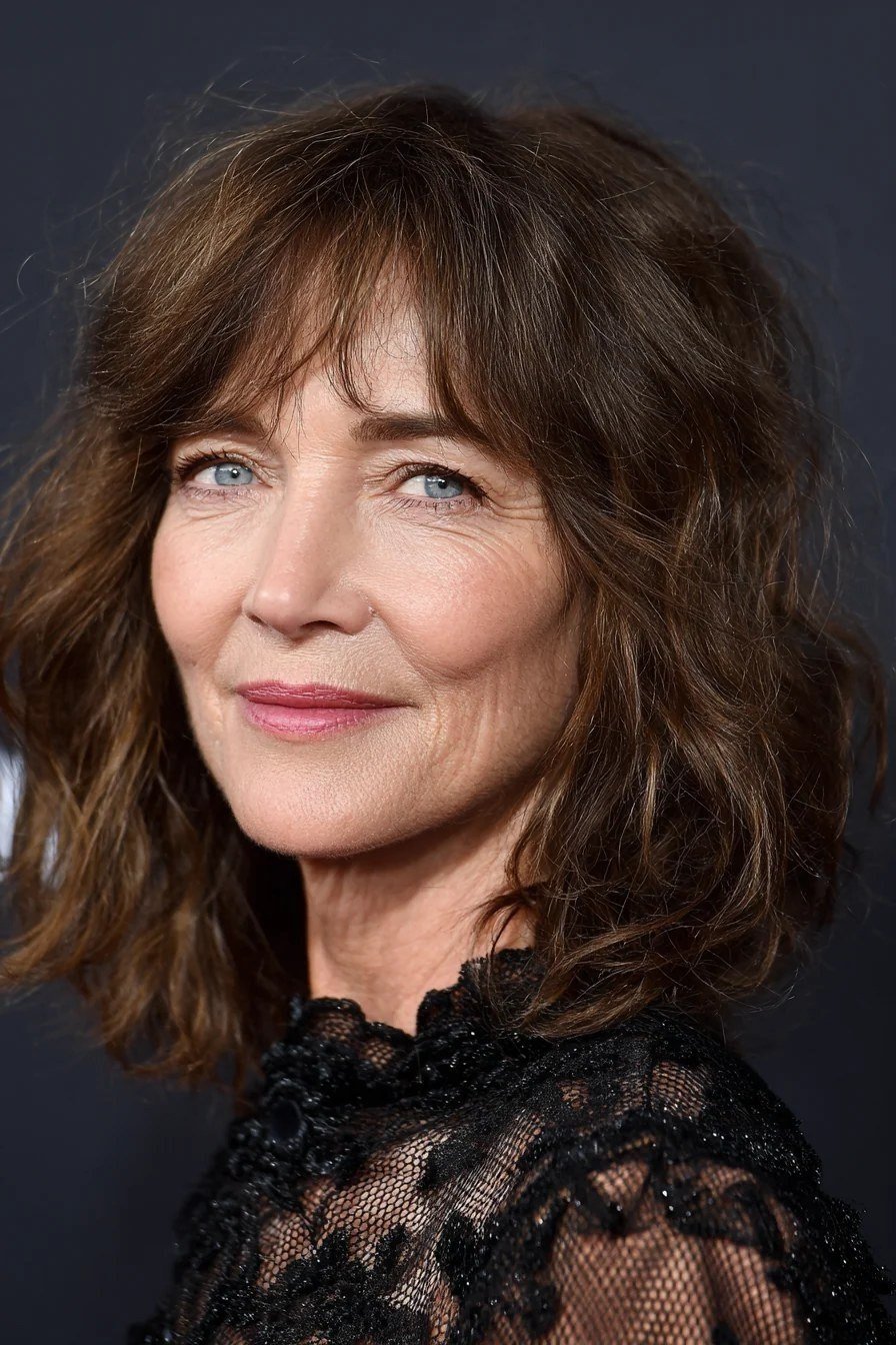 Dark brown curly bob with bangs for older women