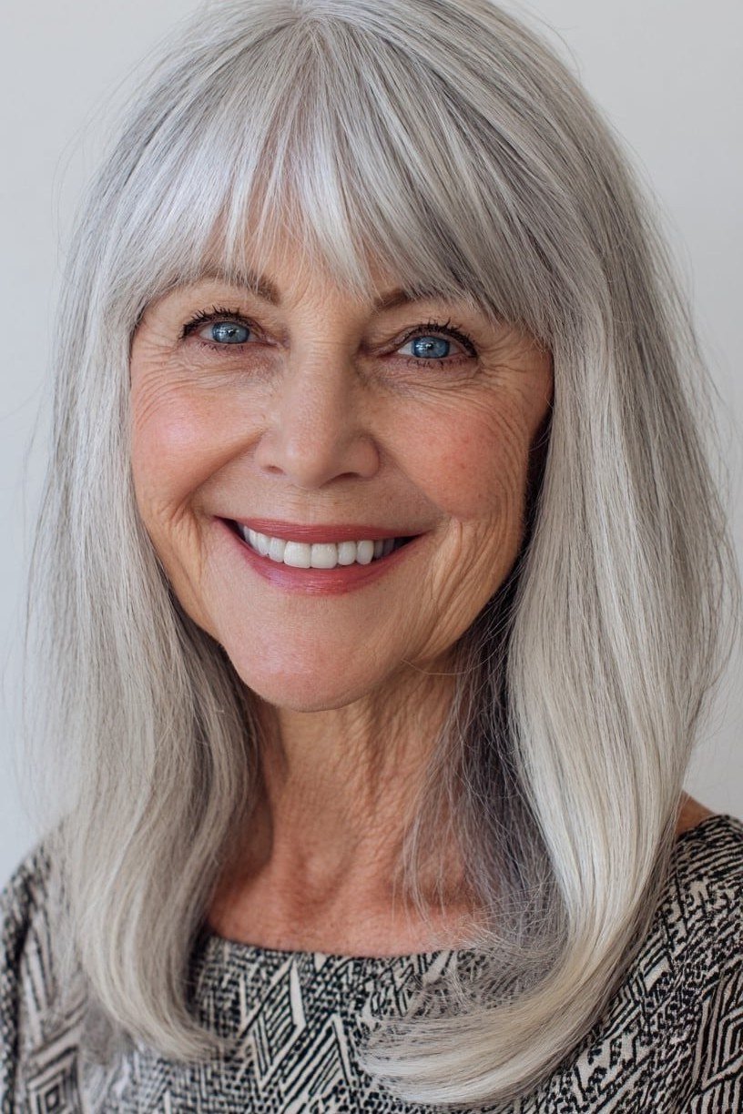 Silver straight layered medium haircut with bangs for women over 60