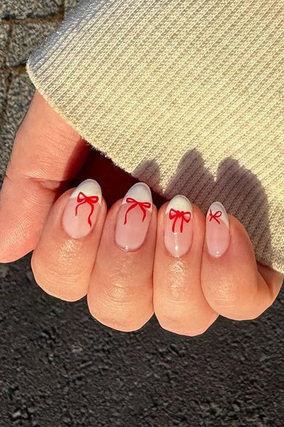 Cute Red Bow Accent - micro french manicure with ultra-thin tip line, elegant nail design for women over 50