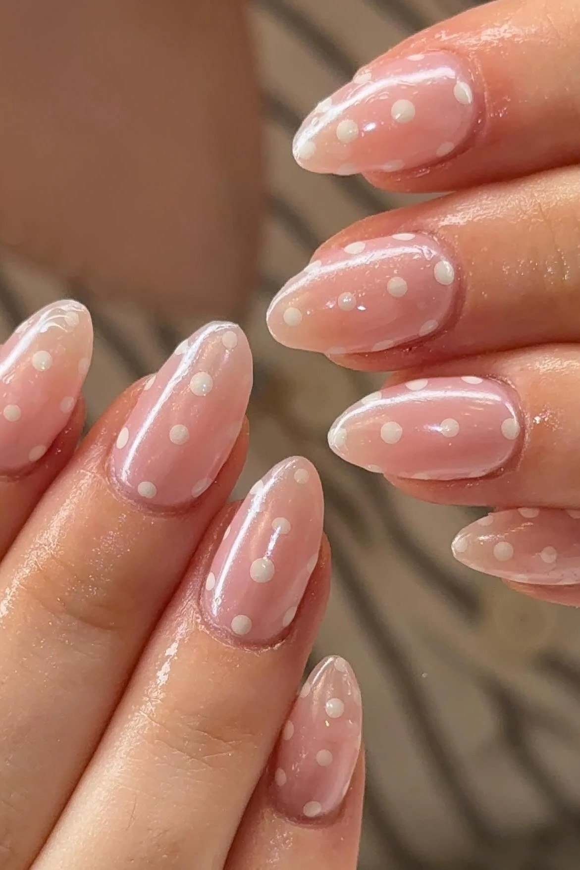 White Polka Dots on Blush Pink Almond minimalist nail art idea for women over 50