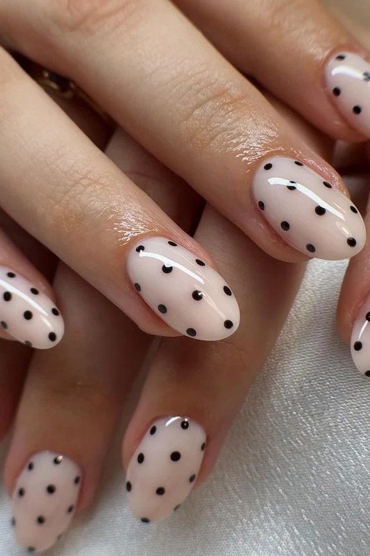 Classic Black Polka Dots on White Almond minimalist nail art idea for women over 50