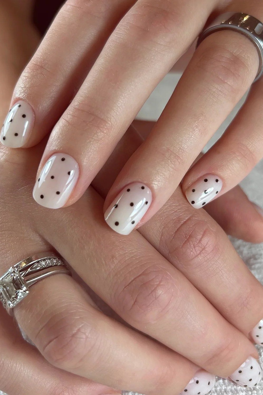 Black Polka Dots on Crisp White minimalist nail art idea for women over 50