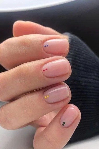 Gold Foil Specks on Warm Beige minimalist nail art idea for women over 50