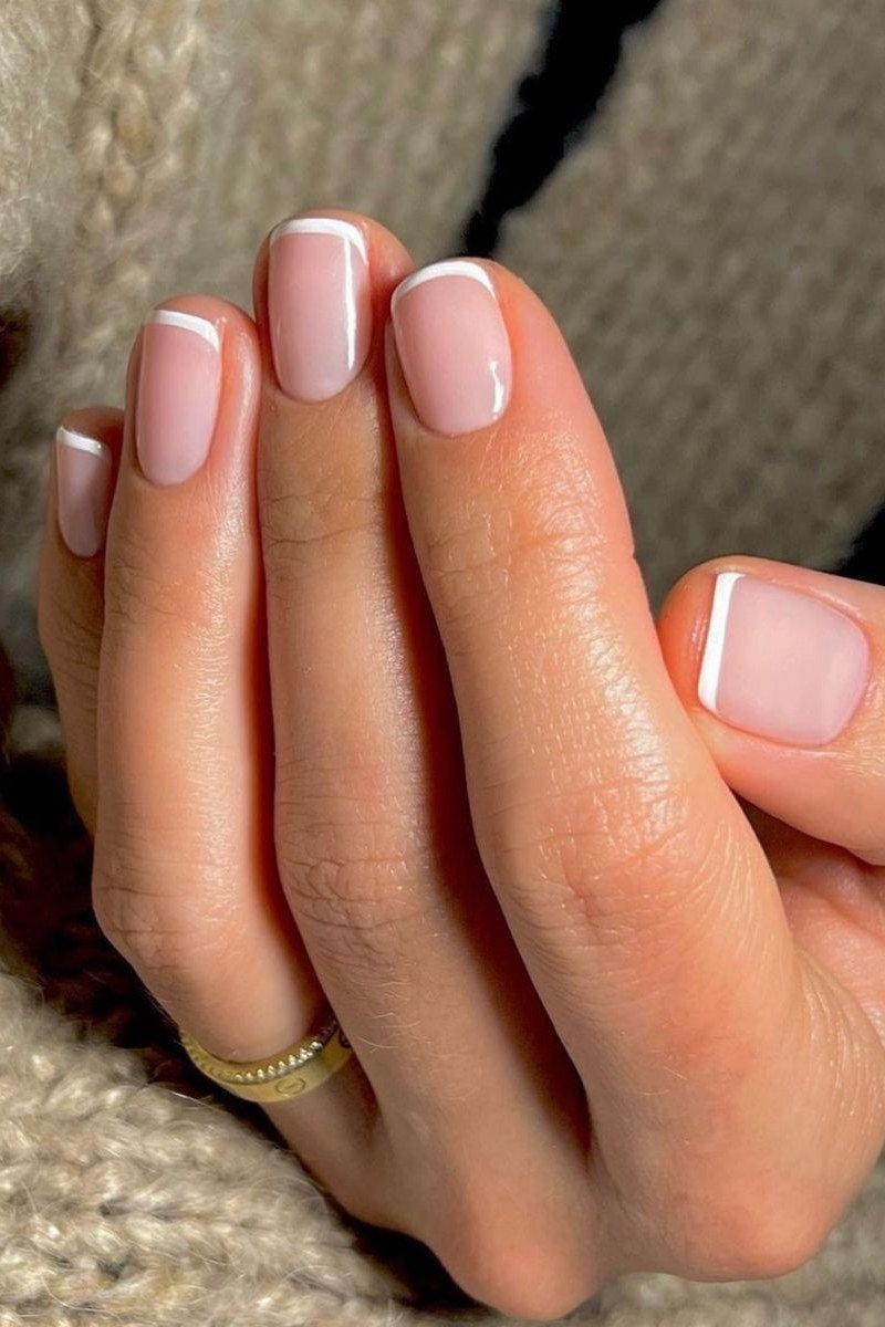 Soft White Tips on Almond minimalist nail art idea for women over 50