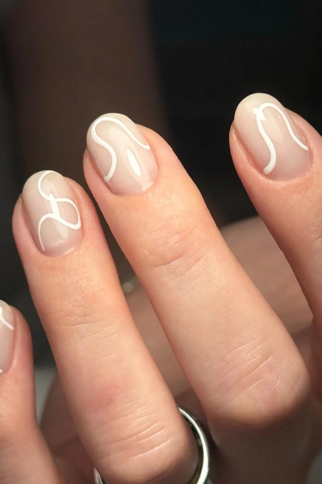 White Swirl Line Art minimalist nail art idea for women over 50
