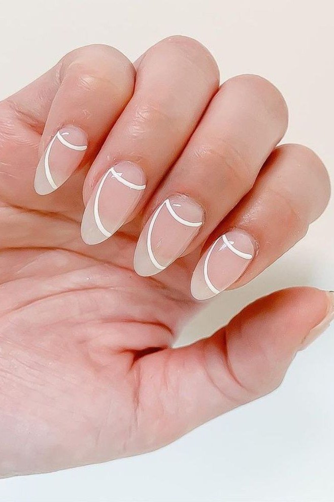 White Wave Lines on Nude Almond minimalist nail art idea for women over 50
