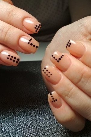 Black Dot Clusters on Nude minimalist nail art idea for women over 50