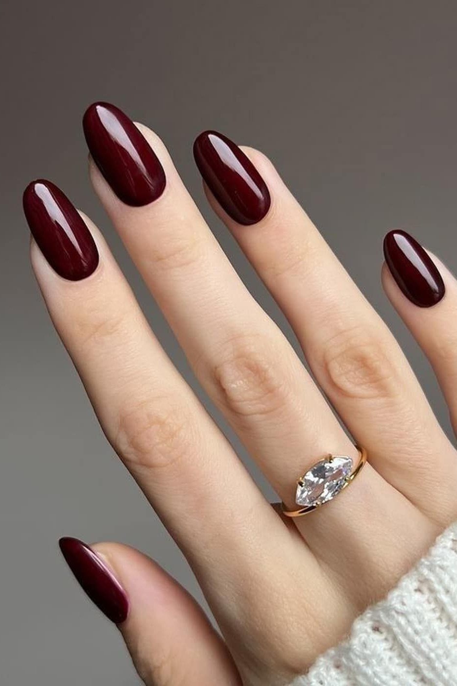 Deep burgundy glossy almond, white sweater nails for women over 50 - classy winter nail idea 1