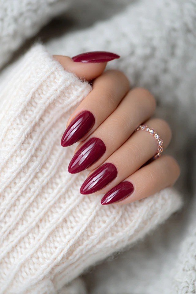 Burgundy almond with gold accent nail nails for women over 50 - classy winter nail idea 2