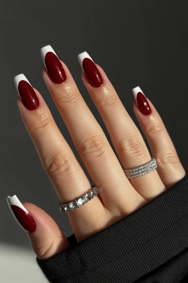 Burgundy with white french tips nails for women over 50 - classy winter nail idea 3