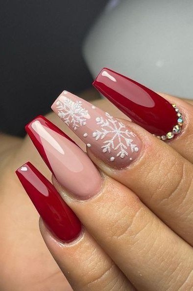 Red with white snowflake accent nail nails for women over 50 - classy winter nail idea 9