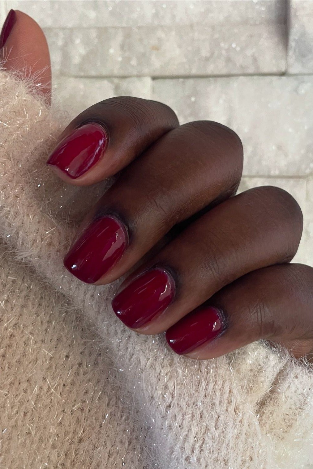 Red almond, deep skin tone nails for women over 50 - classy winter nail idea 10